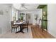 Bright dining room features stylish table and chairs, leading to an inviting area with plants at 3520 Balsam Dr, Winter Park, FL 32792