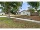 Well-maintained single story home with green grass and mature trees at 3520 Balsam Dr, Winter Park, FL 32792
