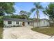 Charming single story home featuring manicured lawn and mature trees at 3520 Balsam Dr, Winter Park, FL 32792