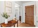 Welcoming foyer featuring natural light and stylish decor with hardwood floors at 3520 Balsam Dr, Winter Park, FL 32792