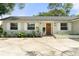 Well maintained exterior with a front yard with a lovely garden area, and inviting front entrance at 3520 Balsam Dr, Winter Park, FL 32792