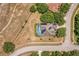 Aerial view of the property showcasing the house, pool, and solar panels on the roof at 3697 Rolling Hills Ln, Apopka, FL 32712