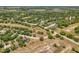 Aerial view of property highlighting its location, pool, and generous lot size with mature trees at 3697 Rolling Hills Ln, Apopka, FL 32712