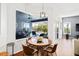 Cozy dining area with pool view and a stylish light fixture, perfect for Gathering meals at 3697 Rolling Hills Ln, Apopka, FL 32712