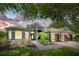 Charming single-story home featuring a well-manicured lawn, paver walkway, and a two-car garage at 3697 Rolling Hills Ln, Apopka, FL 32712
