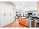 Beautiful kitchen featuring stainless steel appliances, a large island, and ample cabinet space at 3697 Rolling Hills Ln, Apopka, FL 32712