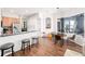 Open concept kitchen and dining area with stainless steel appliances and modern decor at 3697 Rolling Hills Ln, Apopka, FL 32712