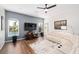 Comfortable living room featuring stylish decor, a media center, and views of the backyard pool at 3697 Rolling Hills Ln, Apopka, FL 32712