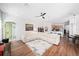 Spacious open concept living room with modern decor, a stylish rug, and plenty of natural light at 3697 Rolling Hills Ln, Apopka, FL 32712