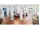 Open-concept living area featuring hardwood floors, lots of arches, and neutral wall paint at 3697 Rolling Hills Ln, Apopka, FL 32712