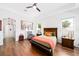 Bright main bedroom features modern decor, hardwood floors, and ample natural light at 3697 Rolling Hills Ln, Apopka, FL 32712