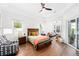 Spacious main bedroom with plenty of natural light and a view of the outdoor space at 3697 Rolling Hills Ln, Apopka, FL 32712