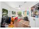 Bright office featuring ample lighting, backyard views, built in shelving, and colorful decor at 3697 Rolling Hills Ln, Apopka, FL 32712