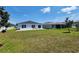 Expansive backyard featuring a patio, perfect for outdoor relaxation and activities at 3838 Whitetail Ct, St Cloud, FL 34772