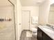 Bright bathroom featuring a glass-enclosed shower, granite counters, and modern fixtures at 3838 Whitetail Ct, St Cloud, FL 34772
