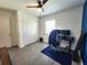 Bedroom with sleek ceiling fan, closet, and wood-style laminate flooring at 3838 Whitetail Ct, St Cloud, FL 34772