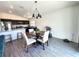 A dining room adjacent to the kitchen area, featuring a round table with seating for four at 3838 Whitetail Ct, St Cloud, FL 34772