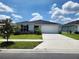 Charming single-story home with well-manicured lawn and inviting curb appeal on a sunny day at 3838 Whitetail Ct, St Cloud, FL 34772