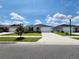 Beautiful single-story home with well-manicured lawn and inviting curb appeal on a sunny day at 3838 Whitetail Ct, St Cloud, FL 34772