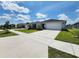 Inviting single-story home with well-manicured lawn and inviting curb appeal on a sunny day at 3838 Whitetail Ct, St Cloud, FL 34772