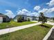Quaint single-story home with well-manicured lawn and inviting curb appeal on a sunny day at 3838 Whitetail Ct, St Cloud, FL 34772