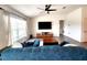 A well lit living room with modern wood flooring and a ceiling fan at 3838 Whitetail Ct, St Cloud, FL 34772