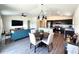 Open-concept layout of the living area, showcasing the dining and kitchen spaces. Features include modern flooring throughout at 3838 Whitetail Ct, St Cloud, FL 34772
