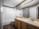 Bathroom featuring double sinks, a wide mirror, and a shower and tub combination at 408 Becky St, Orlando, FL 32824
