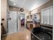 A spacious bathroom featuring a glass shower, black marble tub, and a vanity with a black countertop at 408 Becky St, Orlando, FL 32824