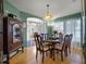Inviting dining room showcasing wood floors and an antique china cabinet at 408 Becky St, Orlando, FL 32824