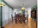 Dining room featuring wood floors, a large mirror, and traditional furniture at 408 Becky St, Orlando, FL 32824