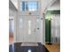 Bright foyer with decorative front door, tile flooring, and high ceilings at 408 Becky St, Orlando, FL 32824