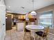 Open concept eat-in kitchen offering natural light, tile floors, and stainless steel appliances at 408 Becky St, Orlando, FL 32824