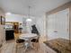 Eat-in kitchen with a round table, tile floors, and granite countertops at 408 Becky St, Orlando, FL 32824