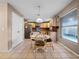 Bright kitchen featuring a breakfast table, natural light, and stainless steel appliances at 408 Becky St, Orlando, FL 32824