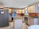 Functional kitchen featuring stainless steel appliances, granite countertops, and ample cabinet space at 408 Becky St, Orlando, FL 32824