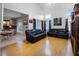 Spacious living room with wood floors and comfortable leather sofas at 408 Becky St, Orlando, FL 32824