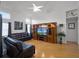 Open concept living area showcasing wood floors, natural light, and a large entertainment center at 408 Becky St, Orlando, FL 32824