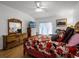 Large main bedroom with a floral comforter, hardwood floors, and a ceiling fan at 408 Becky St, Orlando, FL 32824