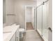Bright bathroom featuring a tiled shower and a large closet at 4116 Se 9Th Ave, Ocala, FL 34480