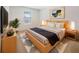Stylish bedroom featuring a platform bed, a patterned rug, and modern bedside lamps at 4116 Se 9Th Ave, Ocala, FL 34480
