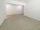 This versatile empty room features light tile flooring, neutral walls, and ample natural light at 4116 Se 9Th Ave, Ocala, FL 34480