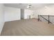 Open loft space featuring a wet bar and a staircase with dark wood accents at 4116 Se 9Th Ave, Ocala, FL 34480
