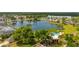 Scenic aerial view of lake and community pool at 4640 Eagle Peak Dr, Kissimmee, FL 34746