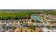 An aerial view displays a home in a neighborhood that has lakes and green spaces at 4640 Eagle Peak Dr, Kissimmee, FL 34746
