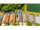 Overhead shot of residential properties, pools, and a peaceful pond at 4640 Eagle Peak Dr, Kissimmee, FL 34746