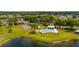 Community pool and tennis courts near lake at 4640 Eagle Peak Dr, Kissimmee, FL 34746
