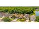 Expansive view of well-maintained homes, lush greenery, and a serene lake at 4640 Eagle Peak Dr, Kissimmee, FL 34746