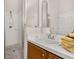 Bathroom with a step-in shower, modern fixtures, and white tiled walls at 4640 Eagle Peak Dr, Kissimmee, FL 34746
