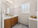 Bathroom with double sink vanity, good lighting, and storage at 4640 Eagle Peak Dr, Kissimmee, FL 34746